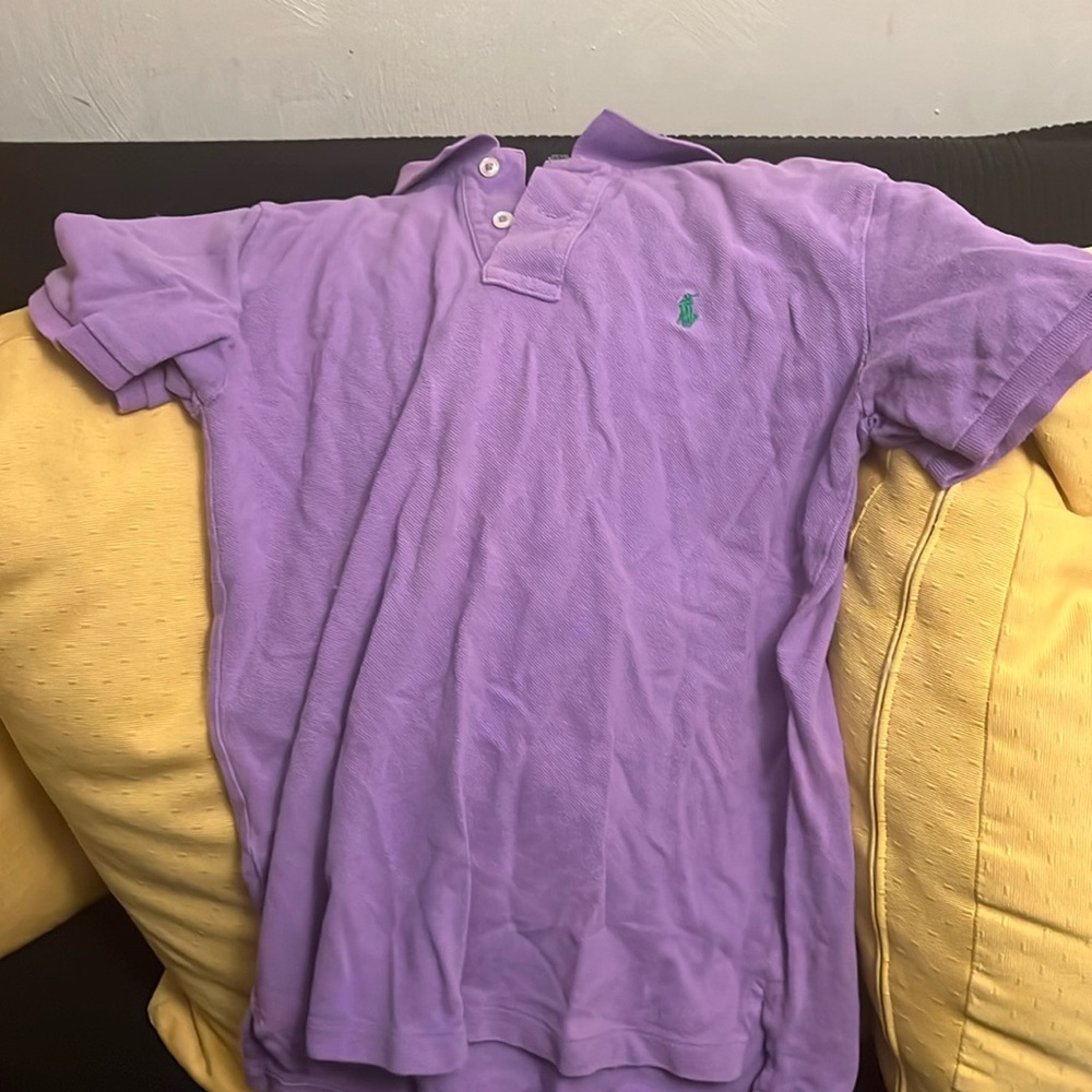 Purple colored polo shirt.